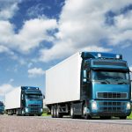 caravan of  trucks on highway, cargo transportation concept